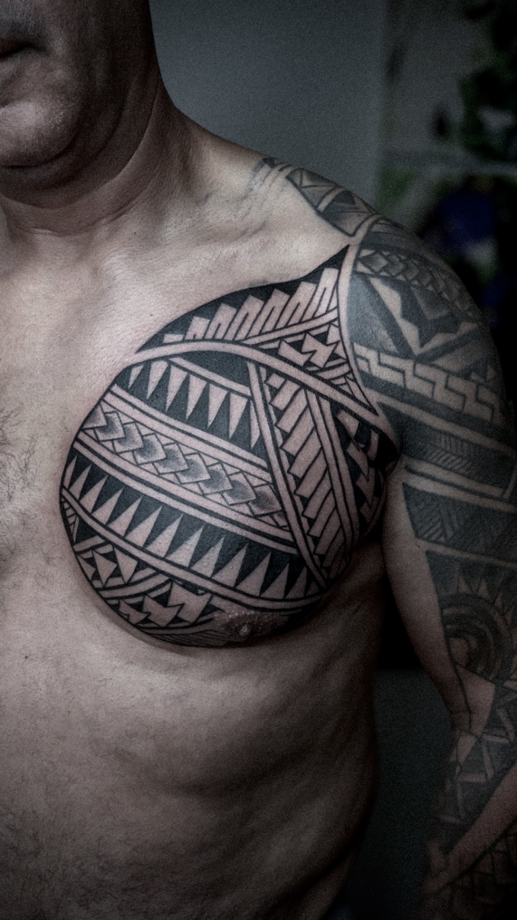 Polynesian geometric chest tattoo